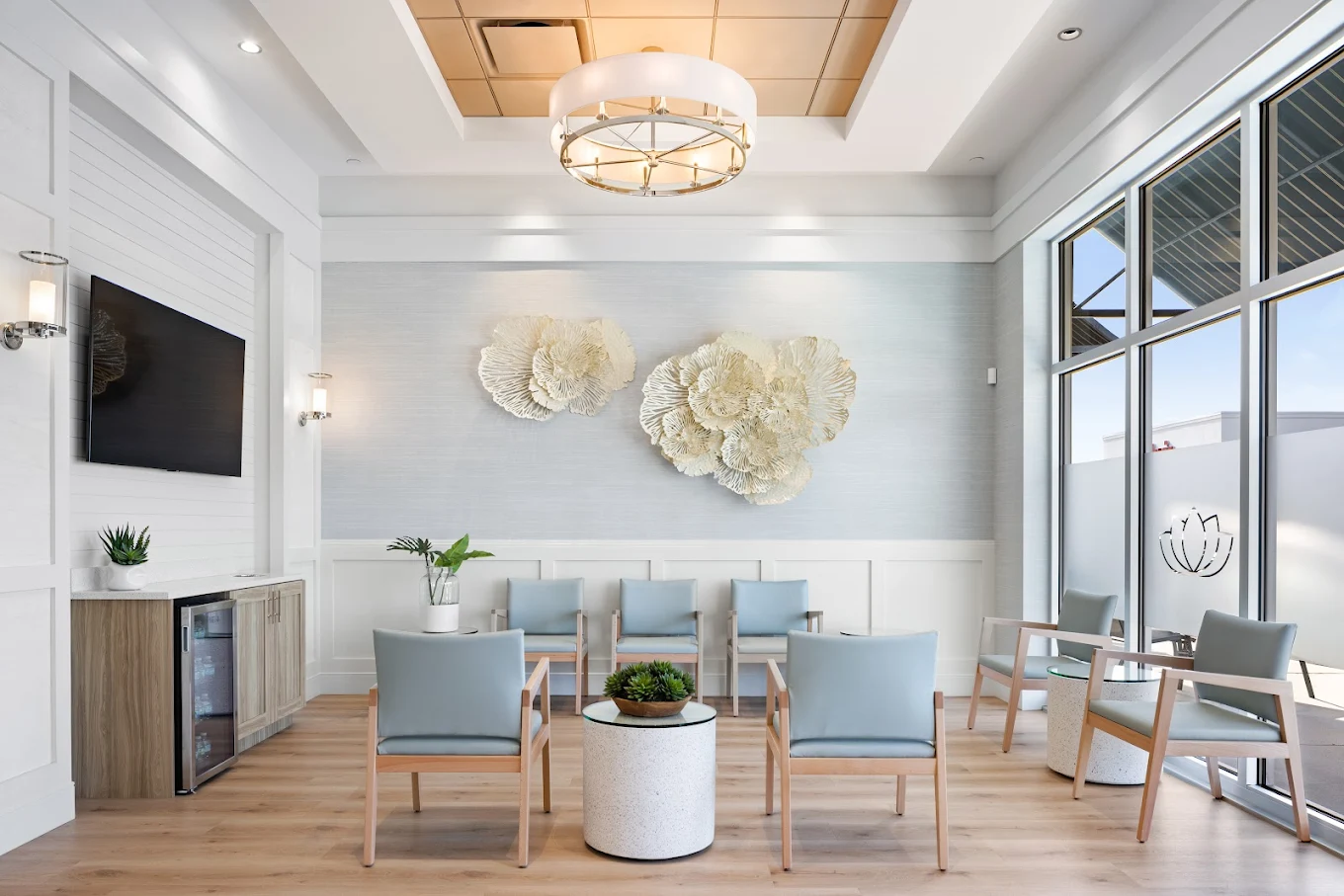Interior waiting room at Arsenault Dermatology’s North Lakewood Ranch office with modern seating and natural light.