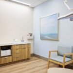Dermatology exam room in the North Lakewood Ranch office with calming design and patient seating.