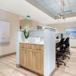 Clinical workspace and nursing area inside the Arsenault Dermatology North Lakewood Ranch office.