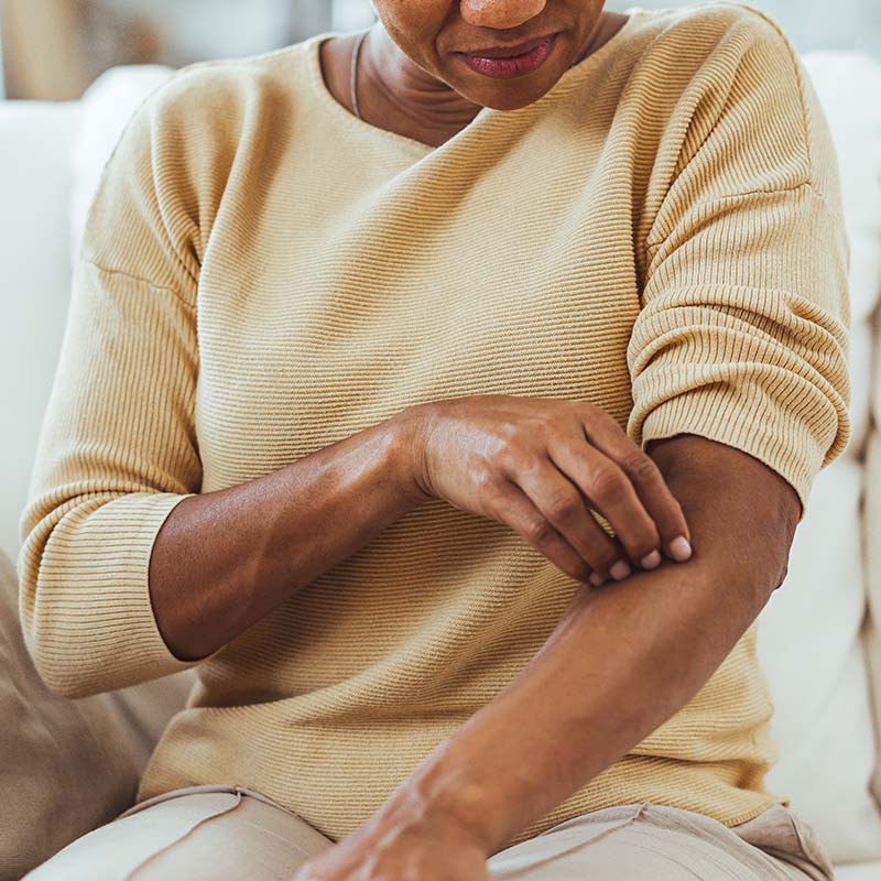 Dermatologist helping a patient manage eczema and psoriasis at the Lakewood Ranch SR 70 office