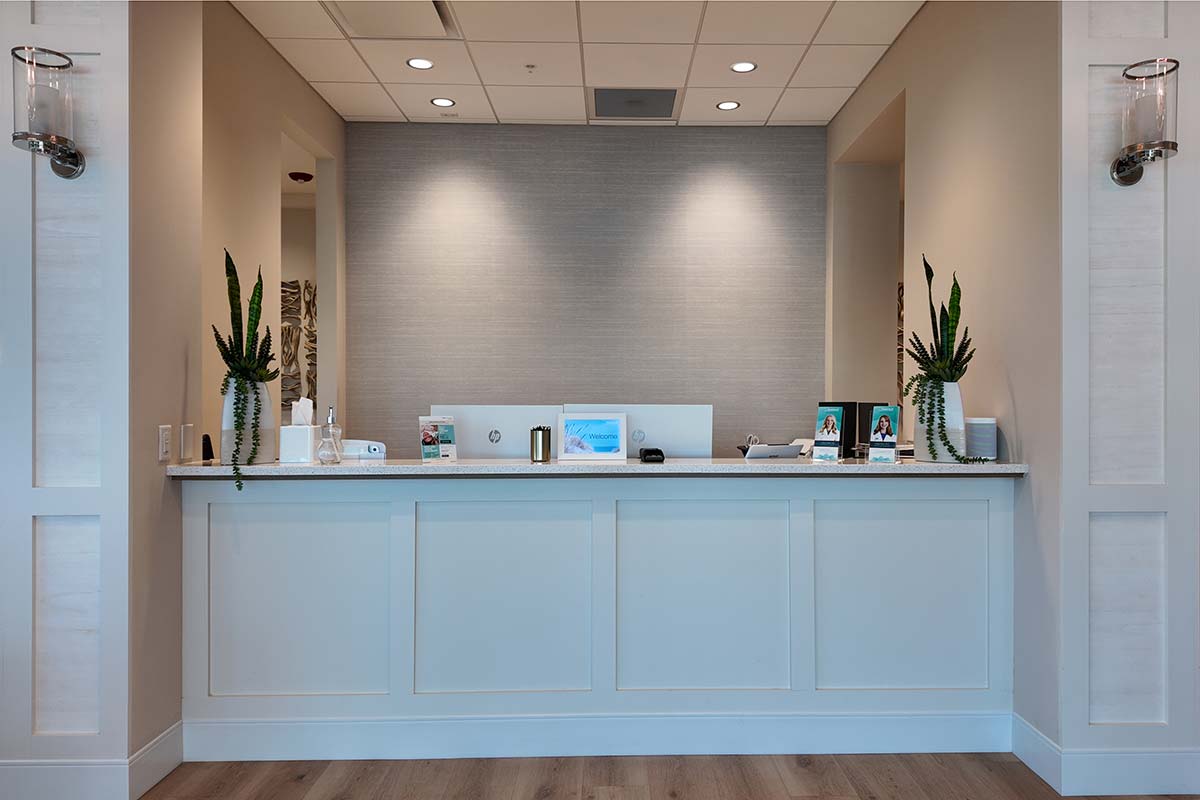 Reception desk and check-in area inside the Arsenault Dermatology Venice office.